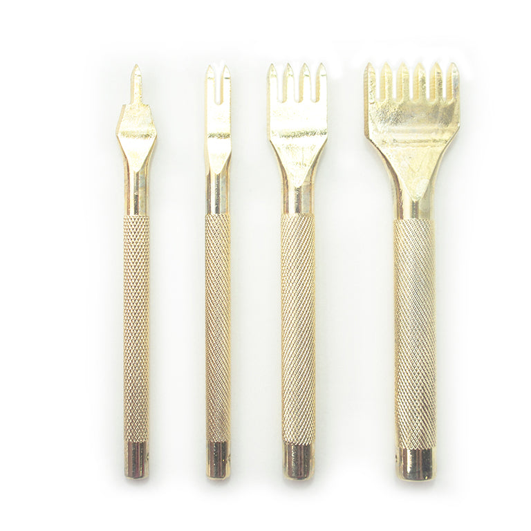 Set of four gold tone metal lacing stitching chisels on a workbench.