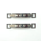 Dark gunmetal tone metal equestrian buckle with 'XES' logo.