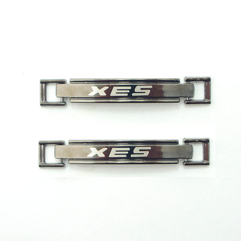 Dark gunmetal tone metal equestrian buckle with 'XES' logo.
