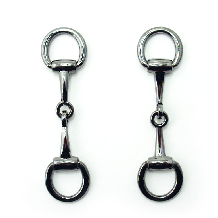 Gunmetal tone metal hinged equestrian buckle on a white background.