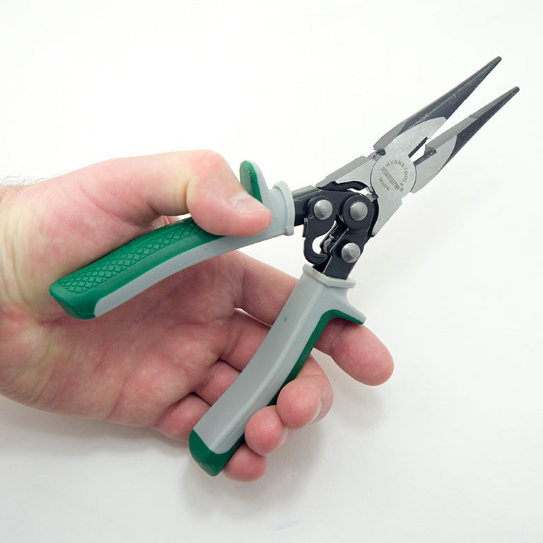 Pliers in use, demonstrating clamping and bending functionality