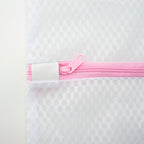 Close-up of a laundry bag showing the small net holes for protection.