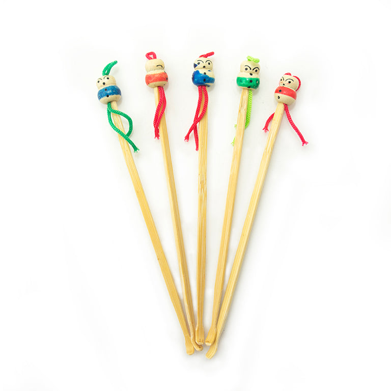 Five bamboo ear wax removers with decorative figures, 12 cm long.