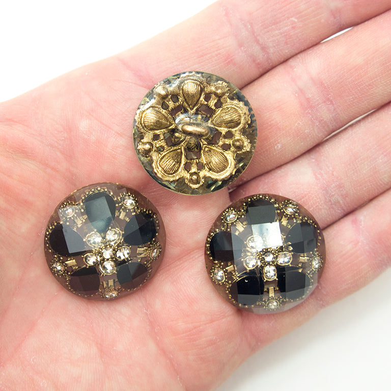 Detailed view of the antique gold tone setting of the button