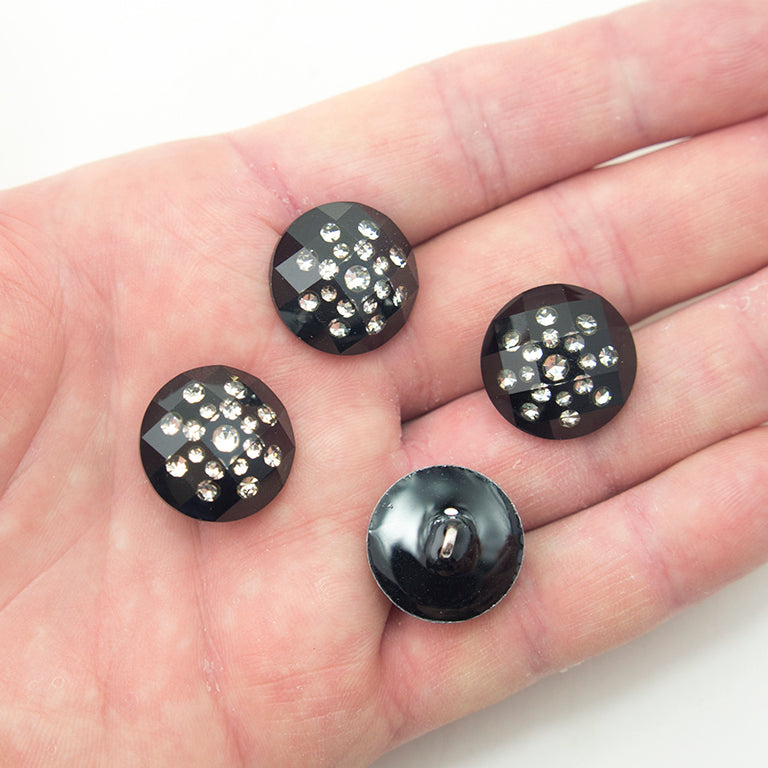 All four clear crystal buttons arranged together