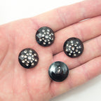 All four clear crystal buttons arranged together