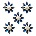 Set of 5 deep blue and clear crystal buttons in silver tone mount.
