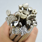 Display of leather craft stamps with silver tone finish