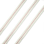 Cream and red cotton flat rope trim on a white background.