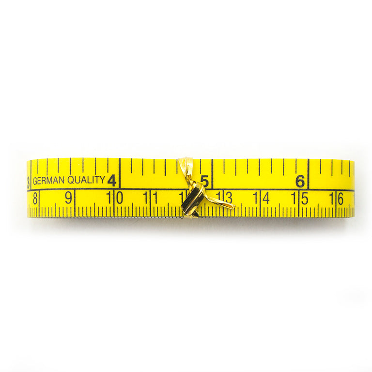 Double sided tape measure showing metric and imperial measurements.