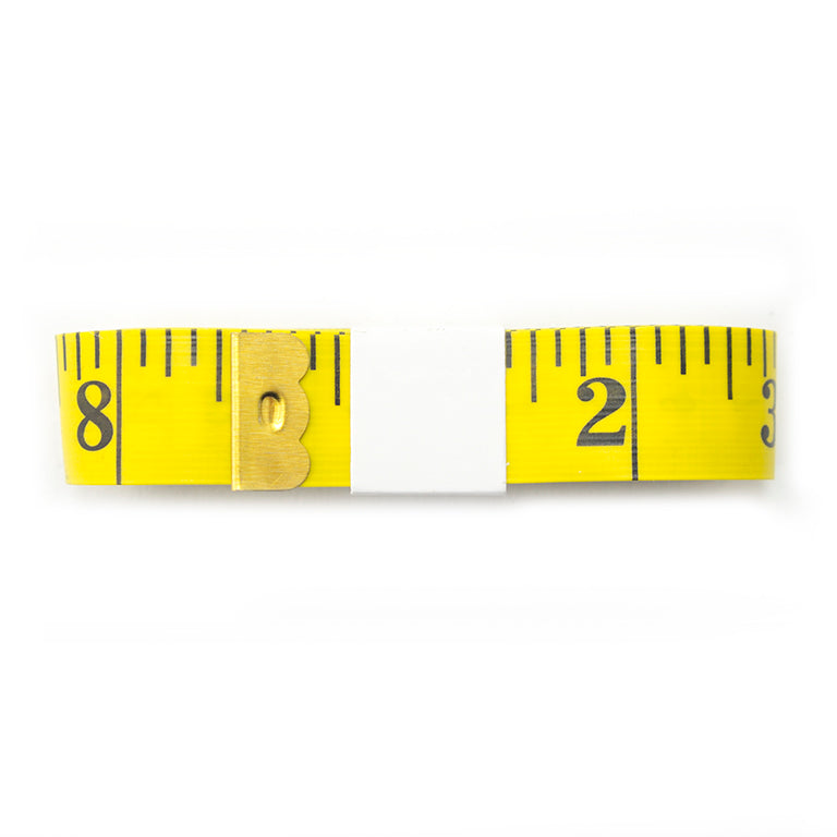 Close-up of the clear large numbers on the tailors tape measure