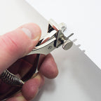 Notcher in use, creating a V ended notch in material