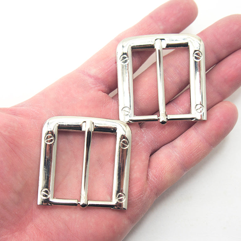 Close-up of a silver tone square buckle measuring 47 x 47 mm.