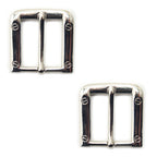 Two large square silver tone buckles for belts and bags.