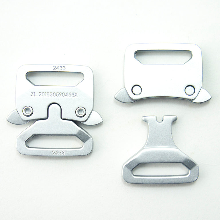 Brushed silver tone buckles displayed with a measuring tape for size reference.
