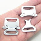Close-up of a brushed silver tone buckle showing its quick release feature.