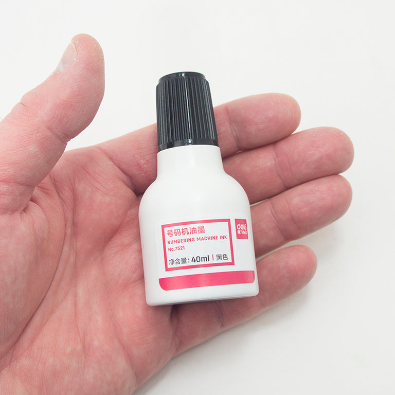 Close-up of 40 ml ink bottles designed for numbering machines.