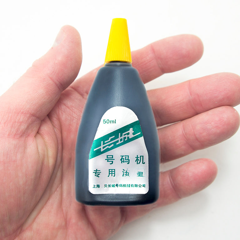 Close-up of 50 ml ink bottle for numbering machines.