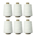 Set of 6 spools of white cotton thread for sewing machines.