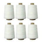 Set of 6 spools of white cotton thread for sewing machines.