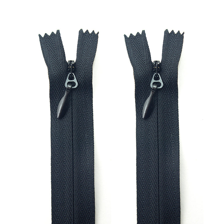 Two heavy duty black invisible zips with metal pulls.