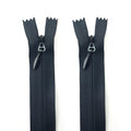Two heavy duty black invisible zips with metal pulls.