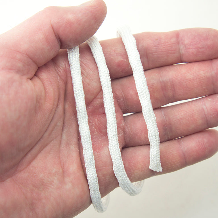 Close-up of lead weighting in hem tape for curtains and dresses.