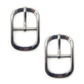 A pair of dark gunmetal buckles for belts and bags.