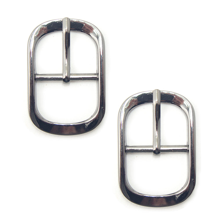 A pair of dark gunmetal buckles for belts and bags.