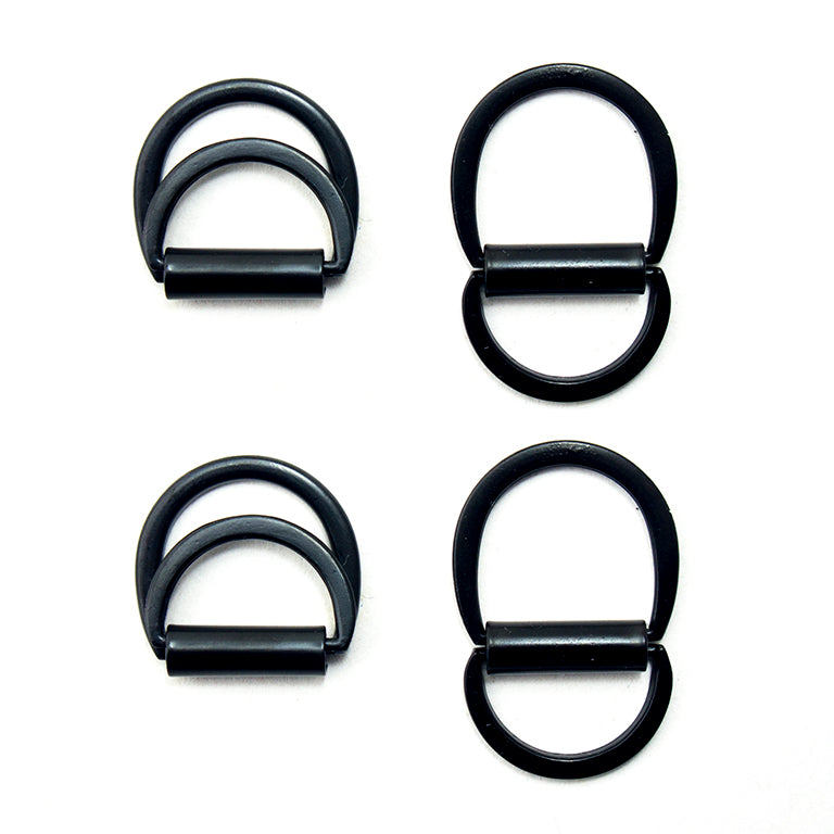 Four small brushed black tone metal locking D rings for crafts.
