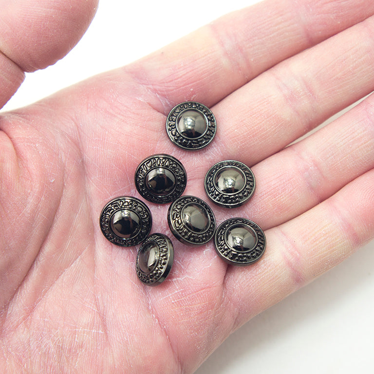 Buttons displayed in a row, highlighting their stylish dark gunmetal finish.