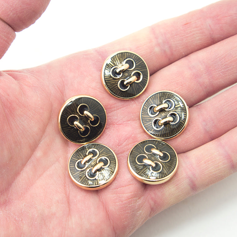 Buttons arranged to show their 23 mm diameter size