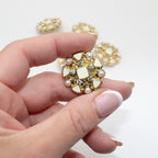 Ivory enamel button being used in a sewing project