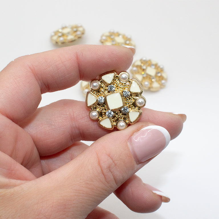 Ivory enamel button being used in a sewing project