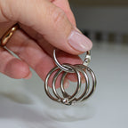 Close-up of a binder ring showing the locking position for security.