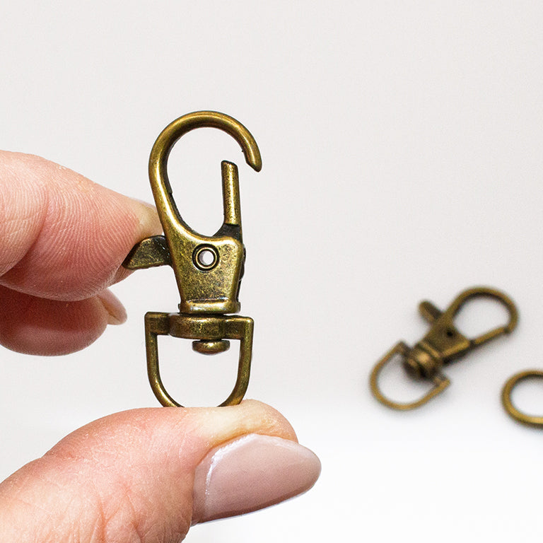 Different angles of the lobster claw clasps showcasing their design.