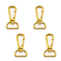 Four gold tone metal swivel snap hooks on a white background.