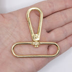 Gold tone swivel clasp with a keychain for practical use.