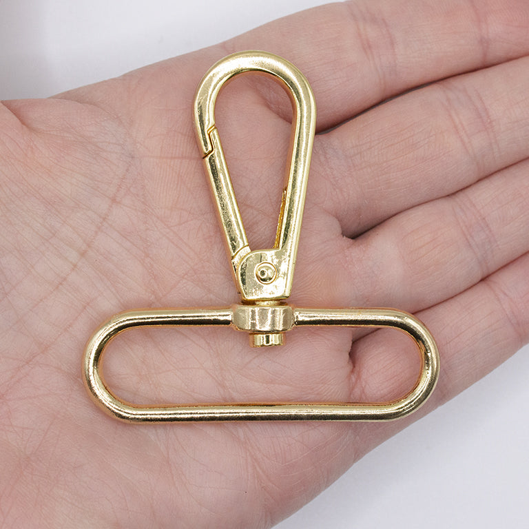 Gold tone swivel clasp with a keychain for practical use.