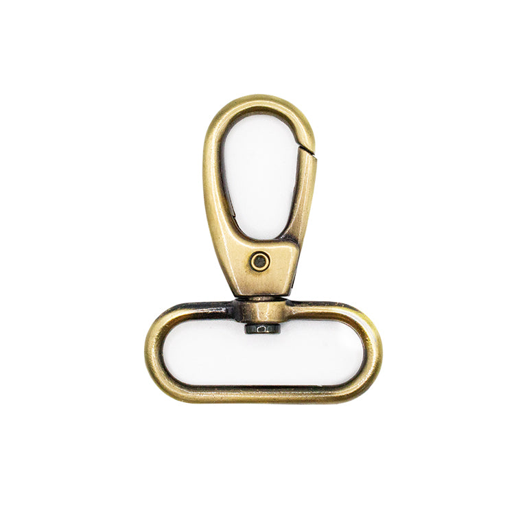 Antique gold tone clasp displayed with various DIY craft supplies.