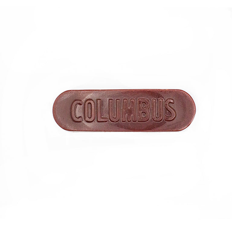 Close-up of Columbus edge wax stick showing its smooth texture.