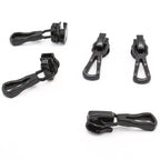 Close-up of a black metal zip pull showing the head slider.