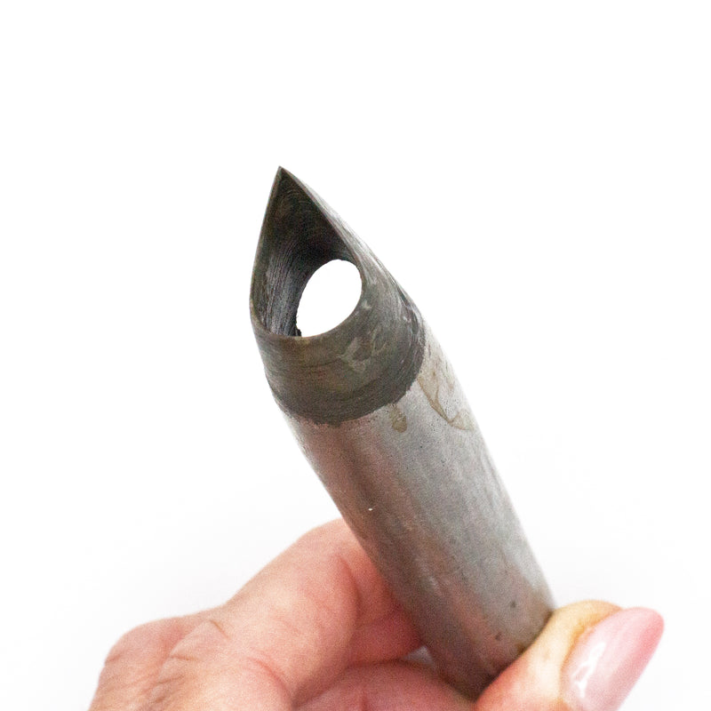 Steel leather punch tool with teardrop shape design.