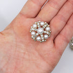 Buttons displayed on a fabric background for sewing projects
