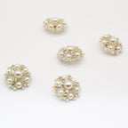 Elegant pearl rhinestone button on a coat sleeve
