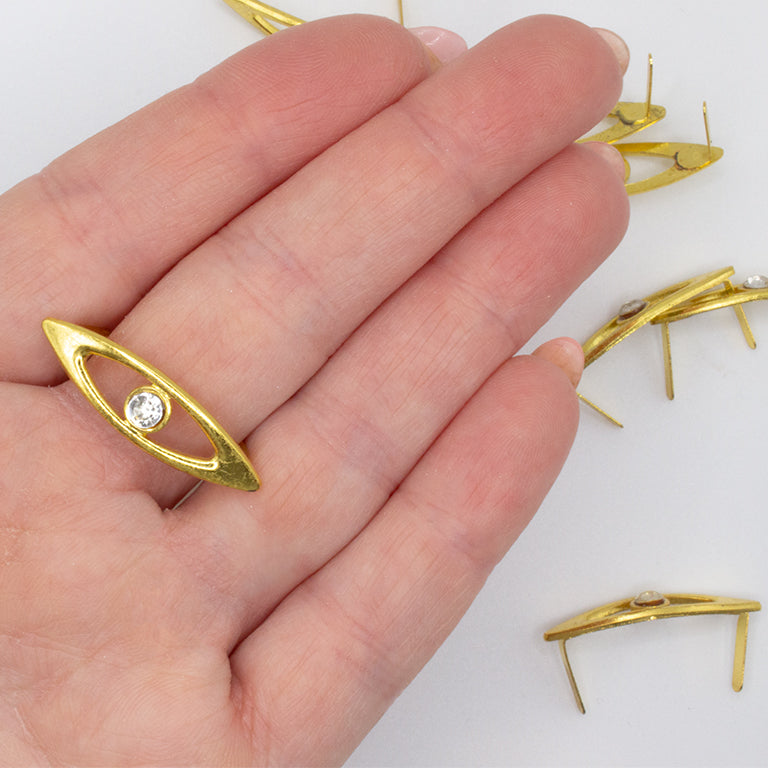 Gold garment trims on a fabric background, ideal for DIY projects.