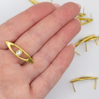 Gold garment trims on a fabric background, ideal for DIY projects.