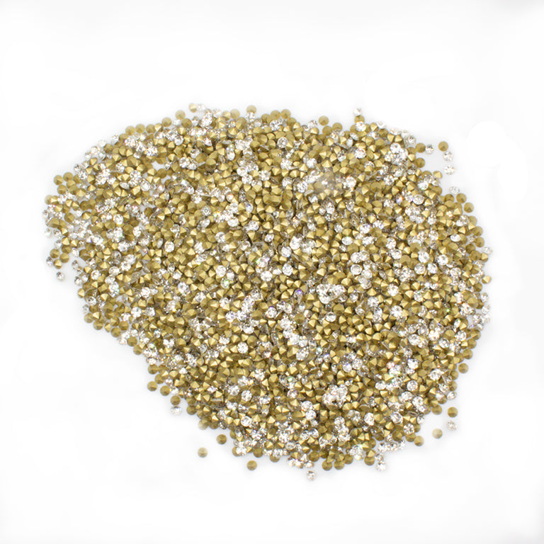 Close-up of clear crystal rhinestones in a bulk pack