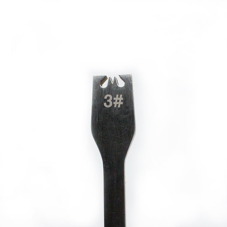 Zipper gear remover tool alongside various zippers