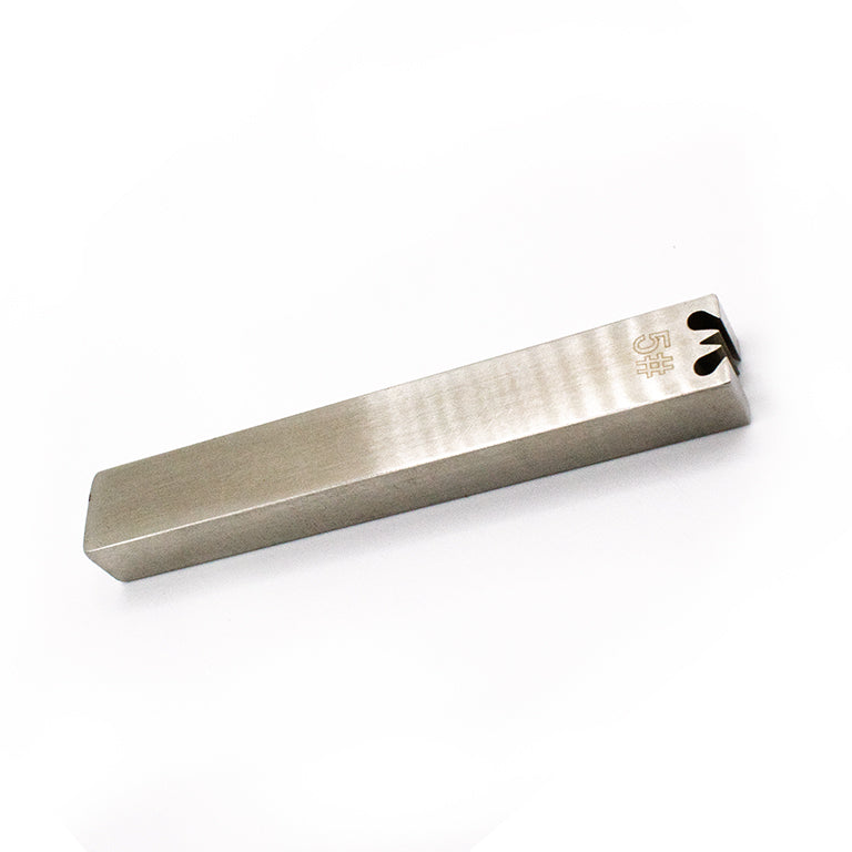 Zipper gear remover in action, removing teeth from a zipper